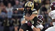 Purdue Boilermakers running back Devin Mockobee (45) is tackled