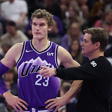 Nov 17, 2023; Salt Lake City, Utah, USA; Utah Jazz forward Lauri Markkanen (23) and head coach Will Hardy speak while the Phoenix Suns shoot free throws in the fourth quarter at Delta Center. Mandatory Credit: Rob Gray-Imagn Images