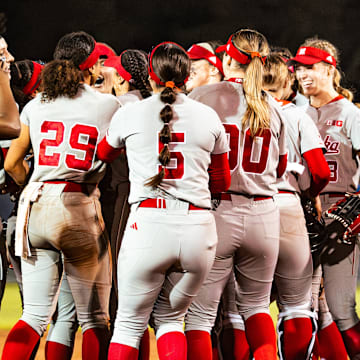 Nebraska softball players celebrate after beating No. 6 Tennessee to open the 2025 season.