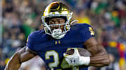 Notre Dame Fighting Irish running back Jadarian Price (24) runs against USC at Notre Dame Stadium. 