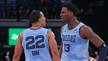 Feb 25, 2025; Memphis, Tennessee, USA; Memphis Grizzlies forward Jaren Jackson Jr. (13) reacts with Memphis Grizzlies guard Desmond Bane (22) during the third quarter against the Phoenix Suns at FedExForum. Mandatory Credit: Petre Thomas-Imagn Images