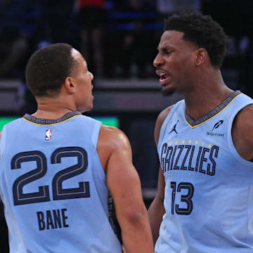 Feb 25, 2025; Memphis, Tennessee, USA; Memphis Grizzlies forward Jaren Jackson Jr. (13) reacts with Memphis Grizzlies guard Desmond Bane (22) during the third quarter against the Phoenix Suns at FedExForum. Mandatory Credit: Petre Thomas-Imagn Images