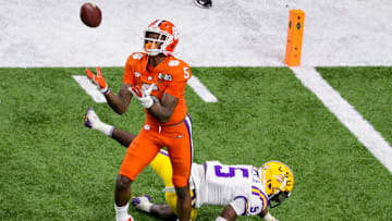 Jan 13, 2020; New Orleans, Louisiana, USA; Clemson Tigers wide receiver Tee Higgins (5) catches a pass for a touchdown against LSU Tigers cornerback Kary Vincent Jr. (5) in the College Football Playoff national championship game at Mercedes-Benz Superdome. Stephen Lew-Imagn Images