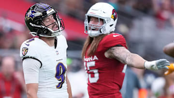 Oct 29, 2023; Glendale, Arizona, USA; Arizona Cardinals linebacker Dennis Gardeck (45) and Baltimore Ravens place kicker Justin Tucker (9) react after a missed field goal during the first half at State Farm Stadium. Mandatory Credit: Joe Camporeale-Imagn Images