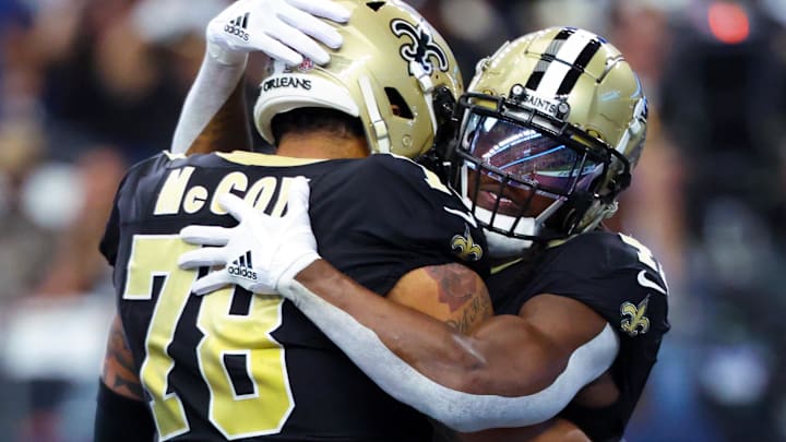 Sep 15, 2024; Arlington, Texas, USA; New Orleans Saints running back Alvin Kamara (41) celebrates with New Orleans Saints center Erik McCoy (78) after scoring a touchdown  during the first quarter against the Dallas Cowboys at AT&T Stadium. Mandatory Credit: Kevin Jairaj-Imagn Images