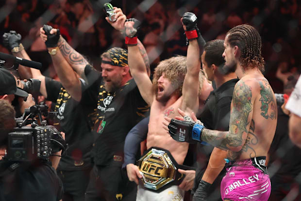 Merab Dvalishvili (red gloves) reacts after defeating Sean O’Malley (not pictured) in a bantamweight title fight.