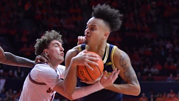 Feb 13, 2024; Champaign, Illinois, USA; Illinois Fighting Illini guard Niccolo Moretti (11) wrestles