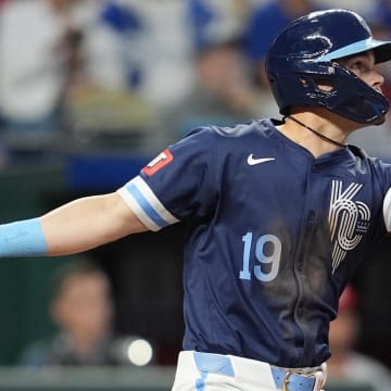 Aug 9, 2024; Kansas City, Missouri, USA; Kansas City Royals second baseman Michael Massey (19) hits an RBI single during the fourth inning against the St. Louis Cardinals at Kauffman Stadium. Mandatory Credit: Jay Biggerstaff-USA TODAY Sports