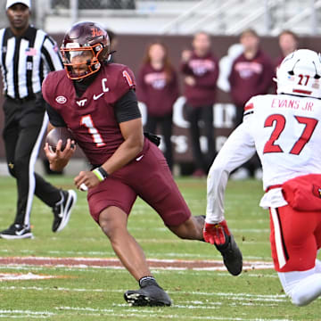 Nov 1, 2025; Blacksburg, Va.; Virginia Tech quarterback Kyron Drones (1) runs the ball.