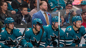 Nov 2, 2024; San Jose, California, USA; San Jose Sharks head coach Ryan Warsofsky watches the game against the Vancouver Canucks during the first period at SAP Center at San Jose. Mandatory Credit: Robert Edwards-Imagn Images
