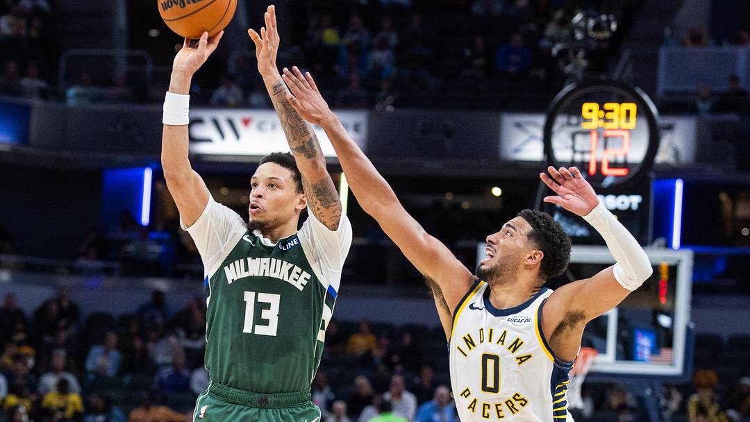 Oct 16, 2026; Indianapolis, Indiana, USA; Milwaukee Bucks guard Ryan Rollins (13) shoots the ball while Indiana Pacers guard Tyrese Haliburton (0) defends in the first half at Gainbridge Fieldhouse. Mandatory Credit: Trevor Ruszkowski-Imagn Images Oct 16, 2026; Indianapolis, Indiana, USA; Milwaukee Bucks guard Ryan Rollins (13) shoots the ball while Indiana Pacers guard Tyrese Haliburton (0) defends in the first half at Gainbridge Fieldhouse. Mandatory Credit: Trevor Ruszkowski-Imagn Images