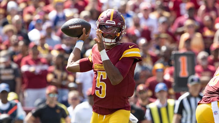 Sep 15, 2024; Landover, Maryland, USA; Washington Commanders quarterback Jayden Daniels (5) drops back tin th first quarter agaistn the New York Giants at Commanders Field. Mandatory Credit: Luke Johnson-Imagn Images

