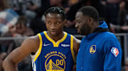 October 30, 2021; San Francisco, California, USA; Golden State Warriors forward Jonathan Kuminga (00) listens to forward Draymond Green (23) during the fourth quarter against the Oklahoma City Thunder at Chase Center. Mandatory Credit: Kyle Terada-Imagn Images