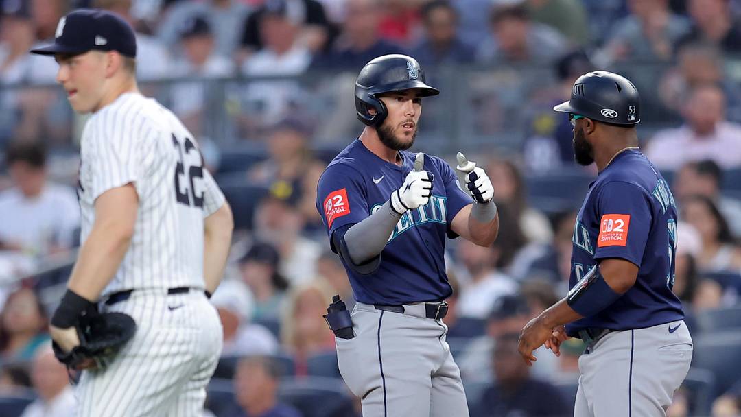 Jul 10, 2025; Bronx, New York, USA; Seattle Mariners third baseman Miles Mastrobuoni (21) celebrates with first base coach Eric Young Jr. (53) after his RBI single against the New York Yankees during the fourth inning at Yankee Stadium. Mandatory Credit: Brad Penner-Imagn Images