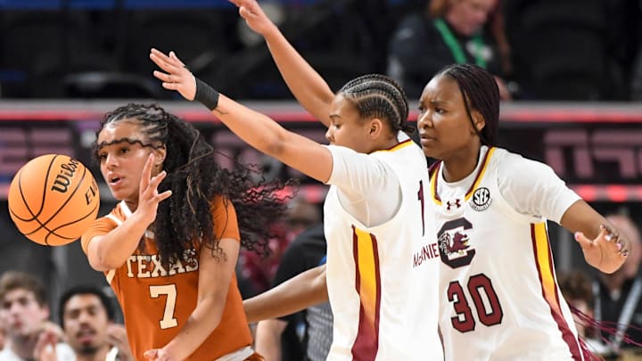 Texas Longhorns guard Jordan Lee (7) is defended by South Carolina Gamecocks guard Maddy McDaniel (1) and South Carolina Gamecocks forward Maryam Dauda (30) Sunday, March 8, 2026, during the SEC Women's Basketball Tournament Championship game at Bon Secours Wellness Arena in Greenville, South Carolina.