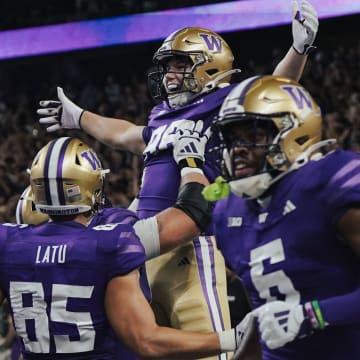 Decker DeGraaf celebrates his 33-yard touchdown catch with his Husky teammates. 