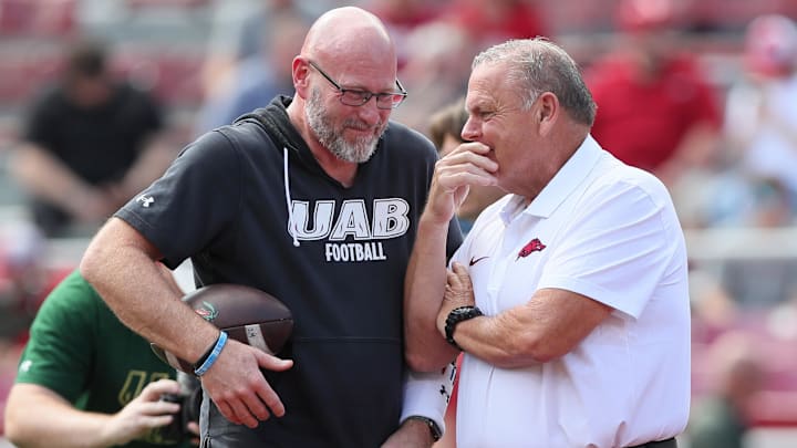 UAB Blazers head coach Trent Dilfer talks to Arkansas Razorbacks head coach Sam Pittman prior to the game at Donald W. Reynolds Razorback Stadium.