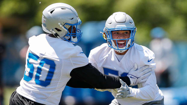 Detroit Lions linebacker Mitchell Agude (50) practices with linebacker DaRon Gilbert (53).