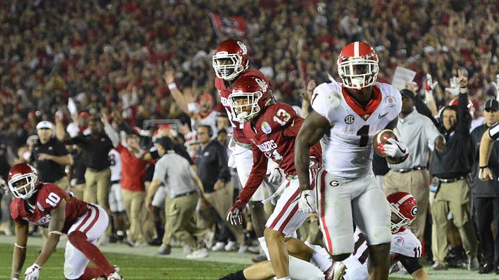 January 1, 2018; Pasadena, CA, USA; Georgia Bulldogs running back Sony Michel (1) runs the ball for the winning touchdown during the overtime period in the 2018 Rose Bowl college football playoff semifinal game at Rose Bowl Stadium. Mandatory Credit: Gary A. Vasquez-Imagn Images

