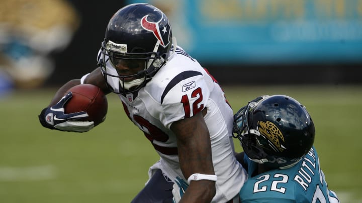 Nov. 27, 2011; Jacksonville FL, USA; Jacksonville Jaguars cornerback Kevin Rutland (12) tackles Houston Texans wide receiver Jacoby Jones (12) during the first half at EverBank Field. Houston defeated Jacksonville 20-13. Mandatory Credit: Matt Stamey-USA TODAY Sports