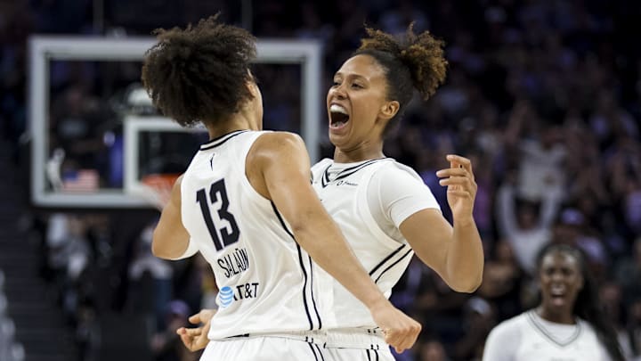 Golden State Valkyries forward Janelle Salaun (13) is congratulated by center Iliana Rupert (12) after she scored against the Dallas Wings during the second half at Chase Center. 