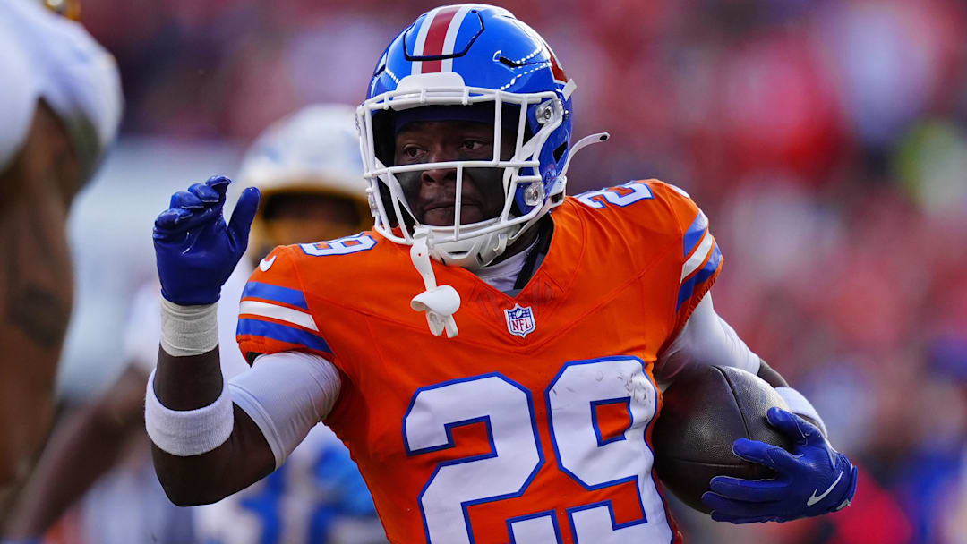 Jan 4, 2026; Denver, Colorado, USA; Denver Broncos cornerback Ja'quan McMillian (29) runs with the ball during the first half against the Los Angeles Chargers at Empower Field at Mile High. 