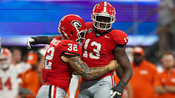 Georgia Bulldogs defensive lineman Mykel Williams (13) celebrates after a tackle with linebacker Chaz Chambliss (32)