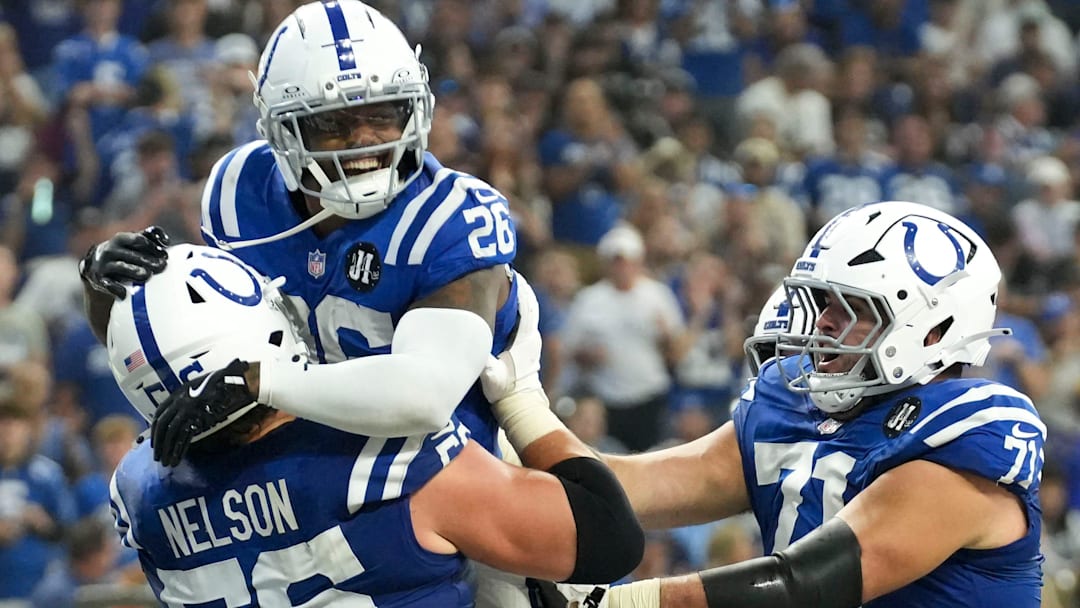 Indianapolis Colts players celebrate Indianapolis Colts running back Ameer Abdullah (26) after Abdullah scores a touchdown Sunday, Oct. 5, 2025, during a game at Lucas Oil Stadium in Indianapolis. The Colts defeated the Raiders 40-6.