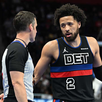 Dec 3, 2024; Detroit, Michigan, USA; Detroit Pistons guard Cade Cunningham (2) talks with the referee during a break in the action against the Milwaukee Bucks in the second quarter at Little Caesars Arena. Mandatory Credit: Lon Horwedel-Imagn Images