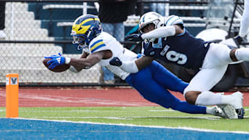 Delaware running back Marcus Yarns takes the ball to the one yard line on a 19-yard gain on fourth down in the second quarter as Villanova's Ty Trinh forced him out of bounds at Villanova Stadium, Saturday, Nov. 23, 2024. The Hens scored on the next play in a furious comeback from down three touchdowns to even the score at the half.