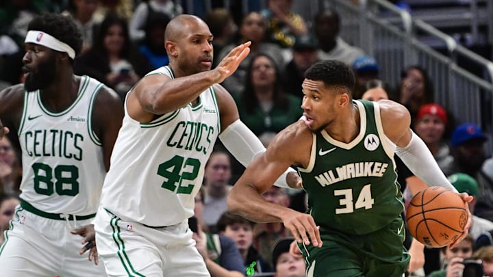 Nov 10, 2024; Milwaukee, Wisconsin, USA; Milwaukee Bucks forward Giannis Antetokounmpo (34) drives for the basket against Boston Celtics center Al Horford (42) in the fourth quarter at Fiserv Forum. Mandatory Credit: Benny Sieu-Imagn Images