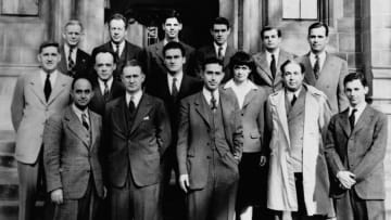 Scientists who worked on the Chicago Pile-1, a component of the Manhattan Project. Leo Szilard is pictured in the middle row in the trench coat.