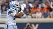 Former North Carolina Tar Heels linebacker Amare Campbell celebrates after recording a sack against the Virginia Cavaliers. 