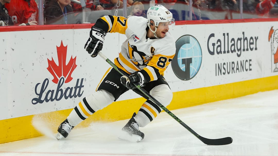 Jan 3, 2026; Detroit, Michigan, USA; Pittsburgh Penguins center Sidney Crosby (87) handles the puck during the third period against the Detroit Red Wings at Little Caesars Arena. Mandatory Credit: Brian Bradshaw Sevald-Imagn Images