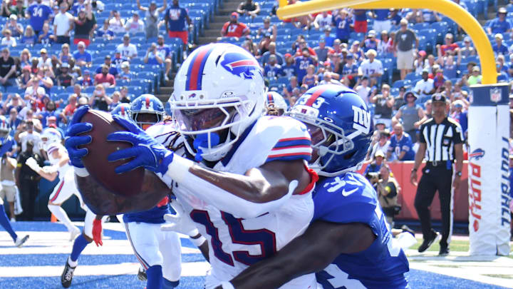 Aug 9, 2025; Orchard Park, New York, USA; Buffalo Bills wide receiver Laviska Shenault Jr. (15) catches a pass for a two point conversion as New York Giants cornerback Dee Williams (33) defends in the fourth quarter at Highmark Stadium. Mandatory Credit: Mark Konezny-Imagn Images