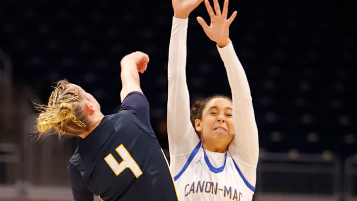 Canon-McMillan's Olivia Ross attempts to block a last-second heave from Norwin's Nia O'Barto during the third quarter of the WPIAL Class 6A championship game Saturday night at Petersen Events Center.