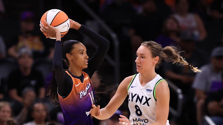 Jul 9, 2025; Phoenix, Arizona, USA; Phoenix Mercury forward DeWanna Bonner (14) against Minnesota Lynx forward Alanna Smith (8) at PHX Arena. Mandatory Credit: Mark J. Rebilas-Imagn Images Jul 9, 2025; Phoenix, Arizona, USA; Phoenix Mercury forward DeWanna Bonner (14) against Minnesota Lynx forward Alanna Smith (8) at PHX Arena. Mandatory Credit: Mark J. Rebilas-Imagn Images