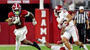 Nov 15, 2025; Tuscaloosa, Alabama, USA;  Alabama Crimson Tide running back Daniel Hill (4) runs the ball against Oklahoma Sooners defensive back Eli Bowen (23) during the third quarter at Saban Field at Bryant-Denny Stadium. Mandatory Credit: David Leong-Imagn Images