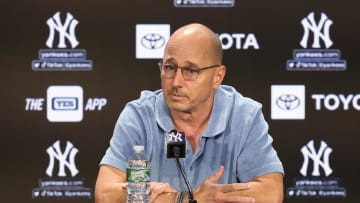 Aug 23, 2023; Bronx, New York, USA; New York Yankees general manager Brian Cashman talks with the