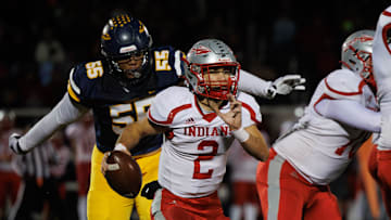 Streetsboro defensive lineman Arthur Scott III closes in on Northwest quarterback Chase Badger during a second-round playoff game Friday, Nov. 8, 2024.