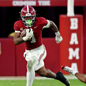Nov 15, 2025; Tuscaloosa, Alabama, USA;  Alabama Crimson Tide running back Daniel Hill (4) runs the ball against Oklahoma Sooners defensive back Eli Bowen (23) during the third quarter at Saban Field at Bryant-Denny Stadium. Mandatory Credit: David Leong-Imagn Images