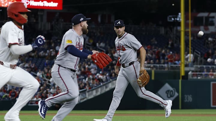 May 20, 2025; Washington, District of Columbia, USA; Atlanta Braves first baseman Matt Olson (28) watches his toss of a fielded ball by Washington Nationals third baseman José Tena (8) to Braves pitcher Aaron Bummer (49) during the seventh inning at Nationals Park. Mandatory Credit: Geoff Burke-Imagn Images