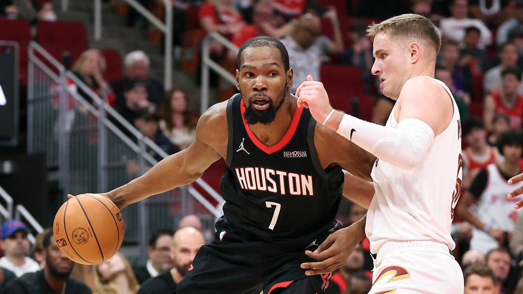 Dec 27, 2025; Houston, Texas, USA;  Houston Rockets forward Kevin Durant (7) controls the ball as Cleveland Cavaliers guard Sam Merrill (5) defends during the third quarter at Toyota Center. Mandatory Credit: Troy Taormina-Imagn Images