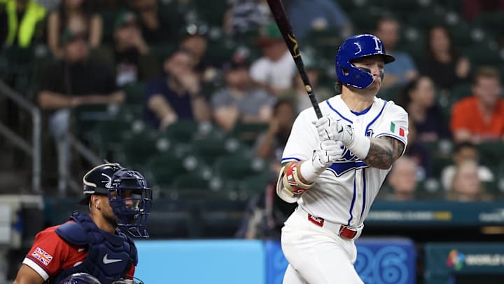 Mar 8, 2026; Houston, TX, United States;  Italy third baseman Andrew Fischer (11) hits a RBI single against the Great Britain in the fourth inning at Daikin Park. Mandatory Credit: Thomas Shea-Imagn Images