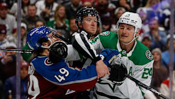 Apr 23, 2025; Denver, Colorado, USA; Linesman CJ Murray (68) separates Colorado Avalanche defenseman Samuel Girard (49) and Dallas Stars center Roope Hintz (24) in the first period in game three of the first round of the 2025 Stanley Cup Playoffs at Ball Arena. Mandatory Credit: Isaiah J. Downing-Imagn Images
