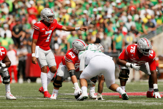 Ohio State Buckeyes quarterback C.J. Stroud (7) calls a play at the line during the first half of the NCAA football game against the Oregon Ducks at Ohio Stadium in Columbus on Saturday, Sept. 11, 2021.