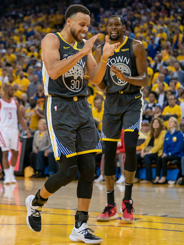 The Golden State Warriors goalkeeper Stephen Curry (30) and the striker Kevin during 