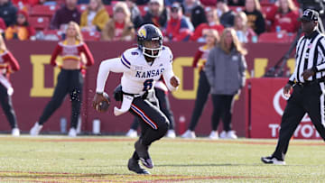 Nov 22, 2025; Ames, Iowa, USA; Kansas Jayhawks quarterback Jalon Daniels (6) runs the football against the Iowa State Cyclones during the second half at Jack Trice Stadium. Mandatory Credit: Reese Strickland-Imagn Images
