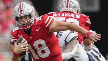 Aug 31, 2024; Columbus, OH, USA; Ohio State Buckeyes quarterback Will Howard (18) scrambles out of the pocket during the NCAA football game against the Akron Zips at Ohio Stadium. Ohio State won 52-6.