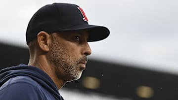 May 29, 2024; Baltimore, Maryland, USA; Boston Red Sox manager Alex Cora (13) looks onto the field during the second inning against the Baltimore Orioles  at Oriole Park at Camden Yards. Mandatory Credit: Tommy Gilligan-Imagn Images